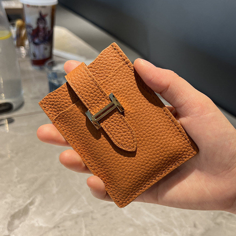 Pull-out card holder: a compact, premium genuine leather case.