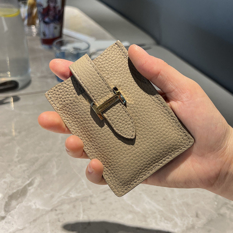 Pull-out card holder: a compact, premium genuine leather case.