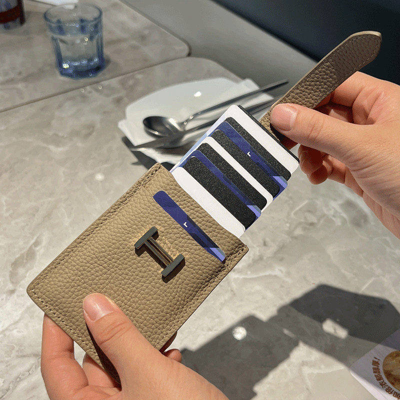 Pull-out card holder: a compact, premium genuine leather case.