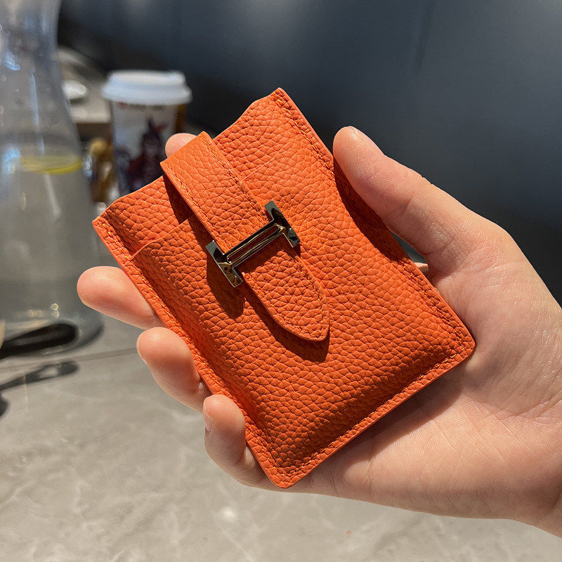 Pull-out card holder: a compact, premium genuine leather case.